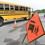 Monongalia County school bus behind caution sign